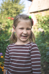 Child with a dental orthodontic device and without one tooth