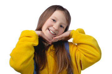 Little cute cheerful girl 10 years old posing in yellow pajamas. Studio photo.
