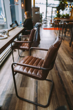 Comfortable leather chair inside indoor restaurant / cafe