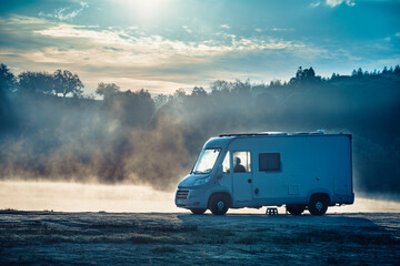 Rv caravan on lake shore. Autumn time, foggy morning - obrazy, fototapety, plakaty