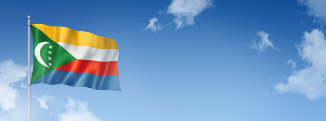 Comorian flag isolated on a blue sky. Horizontal banner