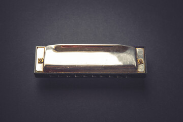 Vintage harmonica isolated on black
