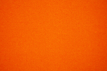 Orange velvet fabric texture used as background. Empty orange fabric background of soft and smooth...