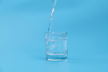 Pouring water into the glass