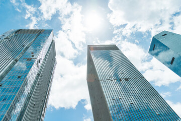 Modern office buildings under cloudy sky