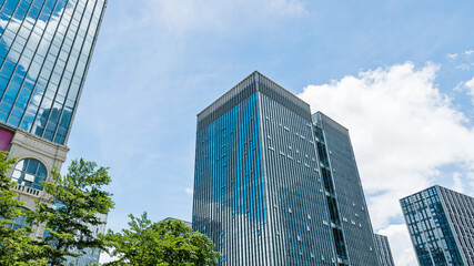 Obraz premium Modern office buildings under blue sky