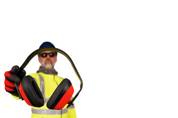 A construction worker in a hi-viz coat and black safety gloves giving ear defenders to viewers isolated on white background.  