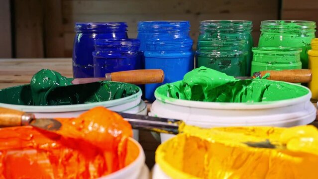 colorful of Plastisol Ink in tee shirt factory..colorful of ink in white bucket..Plastisol ink useful in tee shirt factory and in industry for export..