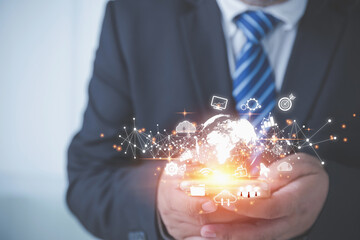 Businessman using smartphone touching virtual world have internet network online, and business icons with copy space black background. Technology information and transformation business concept.
