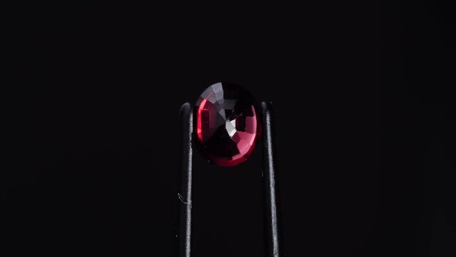 natural red spinel oval gem stone on the turning table