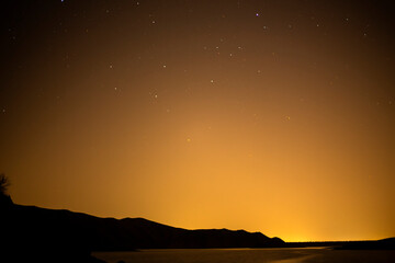 Fototapeta na wymiar sunset at the lake and the stars