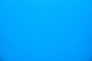Blue light paper background. Illuminated evenly. Homogeneously.
