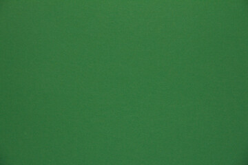 Paper background. Green color. Homogeneous background color.