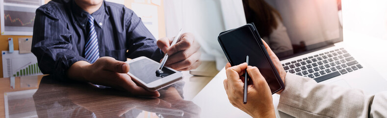 Business people analyzing financial charts and documents in a meeting for the success of company