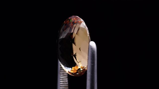 imperial champagne yellow topaz oval cut in the turning tweezers