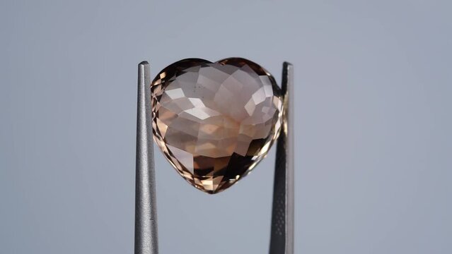 imperial champagne yellow topaz heart cut in the turning tweezers