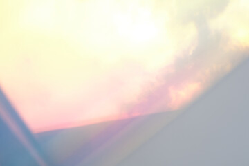 blurred soft rainbow light flares background or overlay. double exposure. blurry reflection of the...