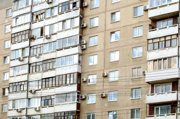 Multi-storey panel residential building with balconies, close-up. The concept of architecture in Russia.