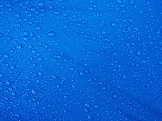 Water drops on waterproof membrane fabric. Morning dew on tent.