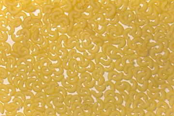 Macaroni. On a white background. Top view.