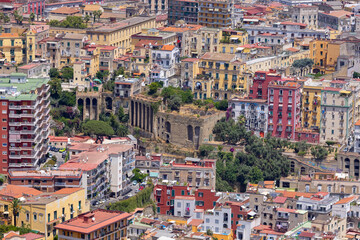 A general aerial view of the city, dense buildings, progressive urbanization of the city, Naples,...