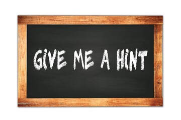 Obraz premium GIVE ME A HINT text written on wooden frame school blackboard.
