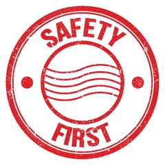 SAFETY FIRST text on red round postal stamp sign