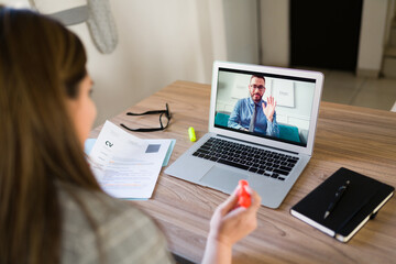 Obraz na płótnie Canvas Man having an online meeting with human resources