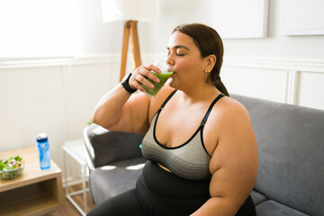 Drinking a protein shake after exercising - obrazy, fototapety, plakaty
