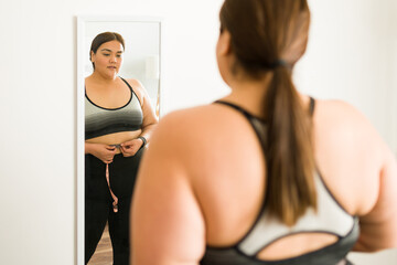 Obese woman with a body positivity concept - obrazy, fototapety, plakaty