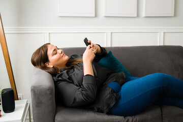 Overweight woman using her smartphone