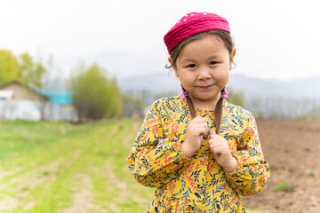 girl in a national headdress. Spring, Nowruz holiday. Kazakh girl. Central Asia, Kazakhstan.