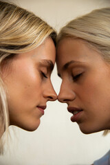 Close up of a lesbian couple embracing.