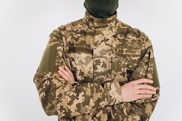 Portrait of a Ukrainian soldier in military uniform on a white background