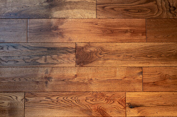 Fototapeta premium New flooring in the house. Beautiful golden handscraped oiled European oak brushed for added texture and fine definition of wood grain.
