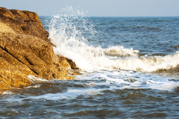 waves crashing on rocks