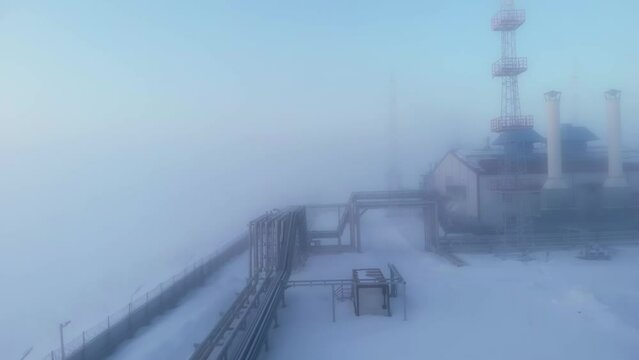 Oil and gas production in the Arctic in conditions of extremely low ambient temperature in winter. Oil and gas plant and pipeline in fog due to low temperature. Fuel crisis in the world.