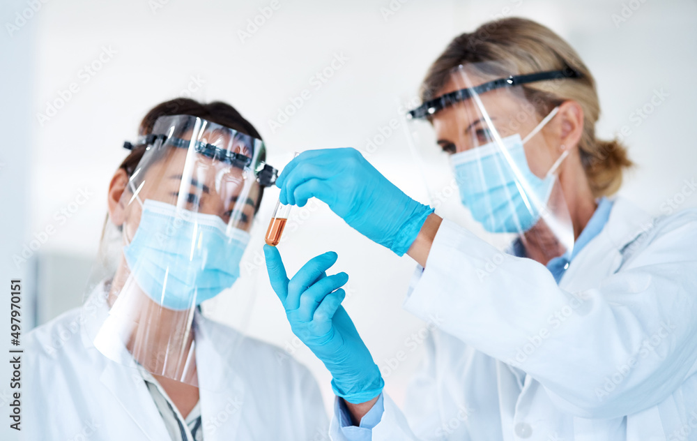 Aufkleber Understanding the workings of the world through science. Shot of two scientists analysing samples together in a lab.