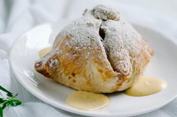 Apples baked in dough. Delicious baked apple dumplings topped with honey. National dish of Czech and Slovak cuisine
