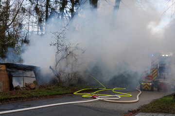 the fire department extinguishes a garden house