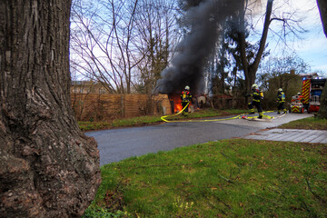 the fire department extinguishes a garden house