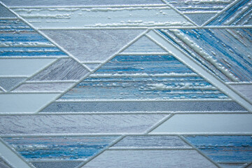 Geometric pattern of blue color on tile