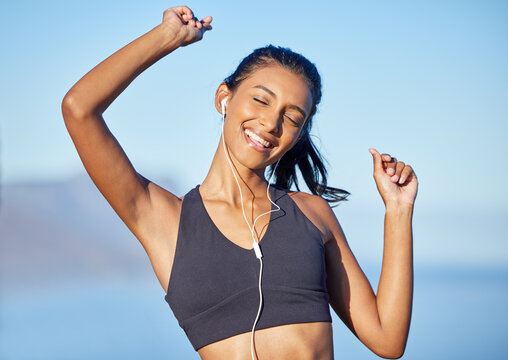 Music lifts my mood in an instant. Shot of a sporty young woman listening to music while exercising outdoors.