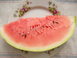 Fresh sliced watermelon close-up  Beautiful  organic eco wegan  photo food background  Slices of juicy and tasty watermelon on a white plate.