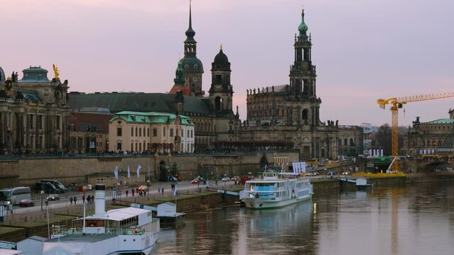 Dresden, Germany. View at main landmarks in the city of Dresden, Germany at sunset. Time-lapse from day to night with car traffic and reflection in the river, panning video