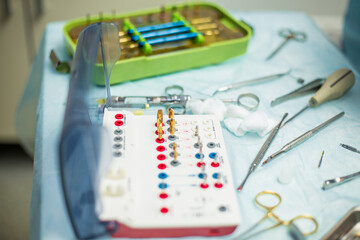 Professional stomatological tools on the table in dentaist cabinet during surgery closeup