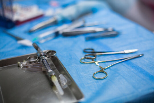 Professional dentist tools on the table with stomatological instruments in hospital during surgery closeup