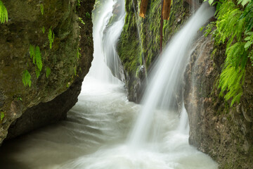 waterfall in the mountains of Chechnya in the spring in a picturesque forest