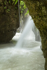 waterfall in the mountains of Chechnya in the spring in a picturesque forest