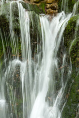 waterfall in the mountains of Chechnya in the spring in a picturesque forest